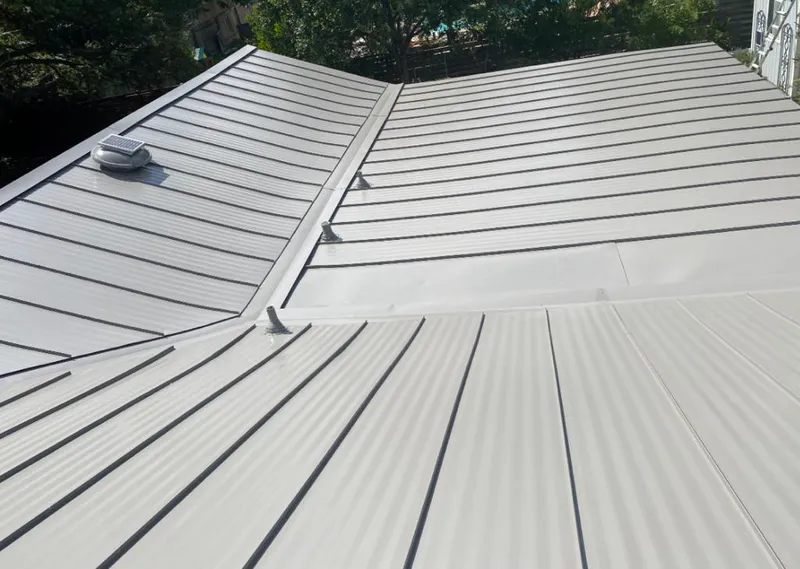Solar attic fan installed on a metal roof for Roof Ventilation in Green River